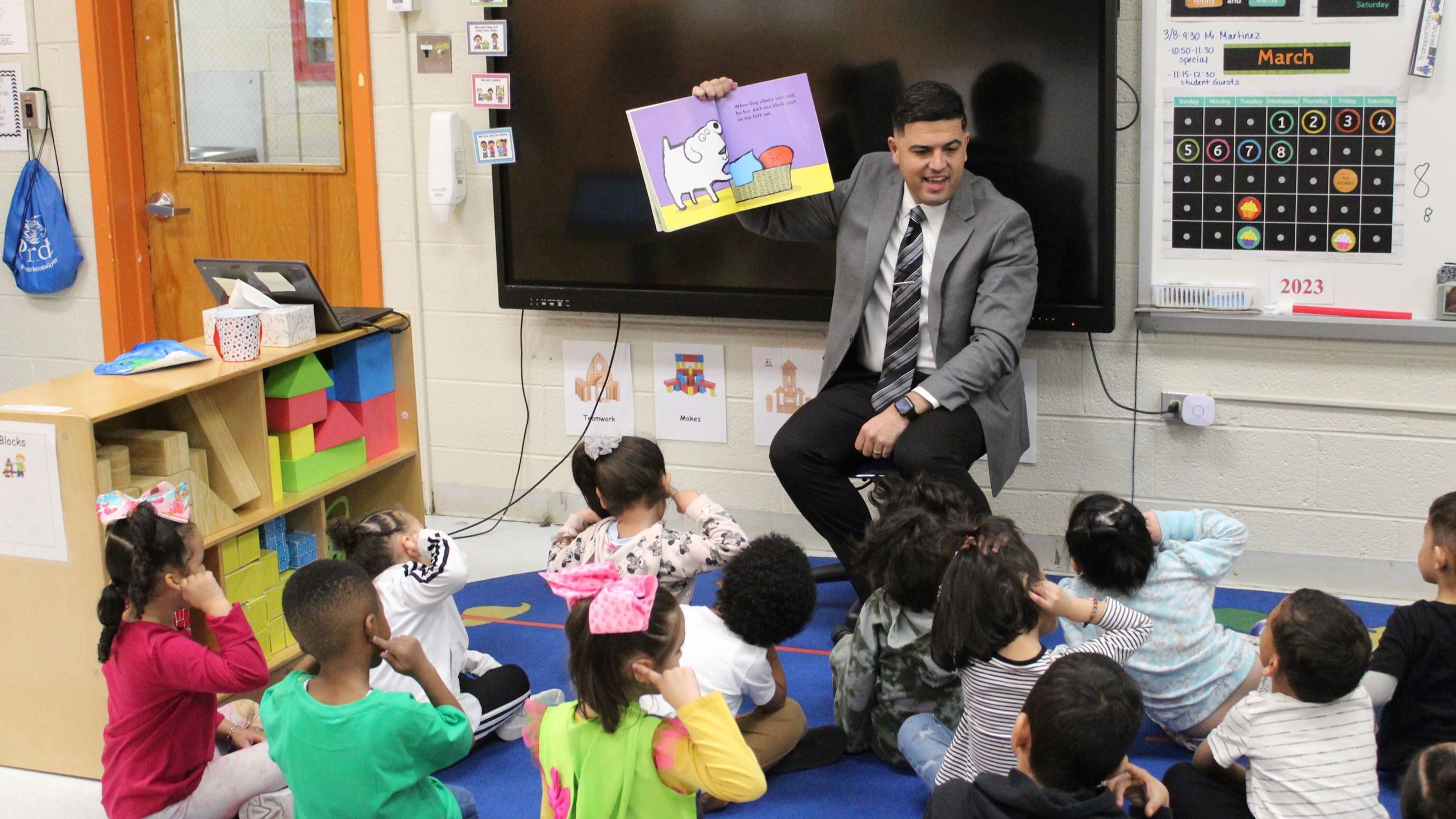 Vince reading to kids